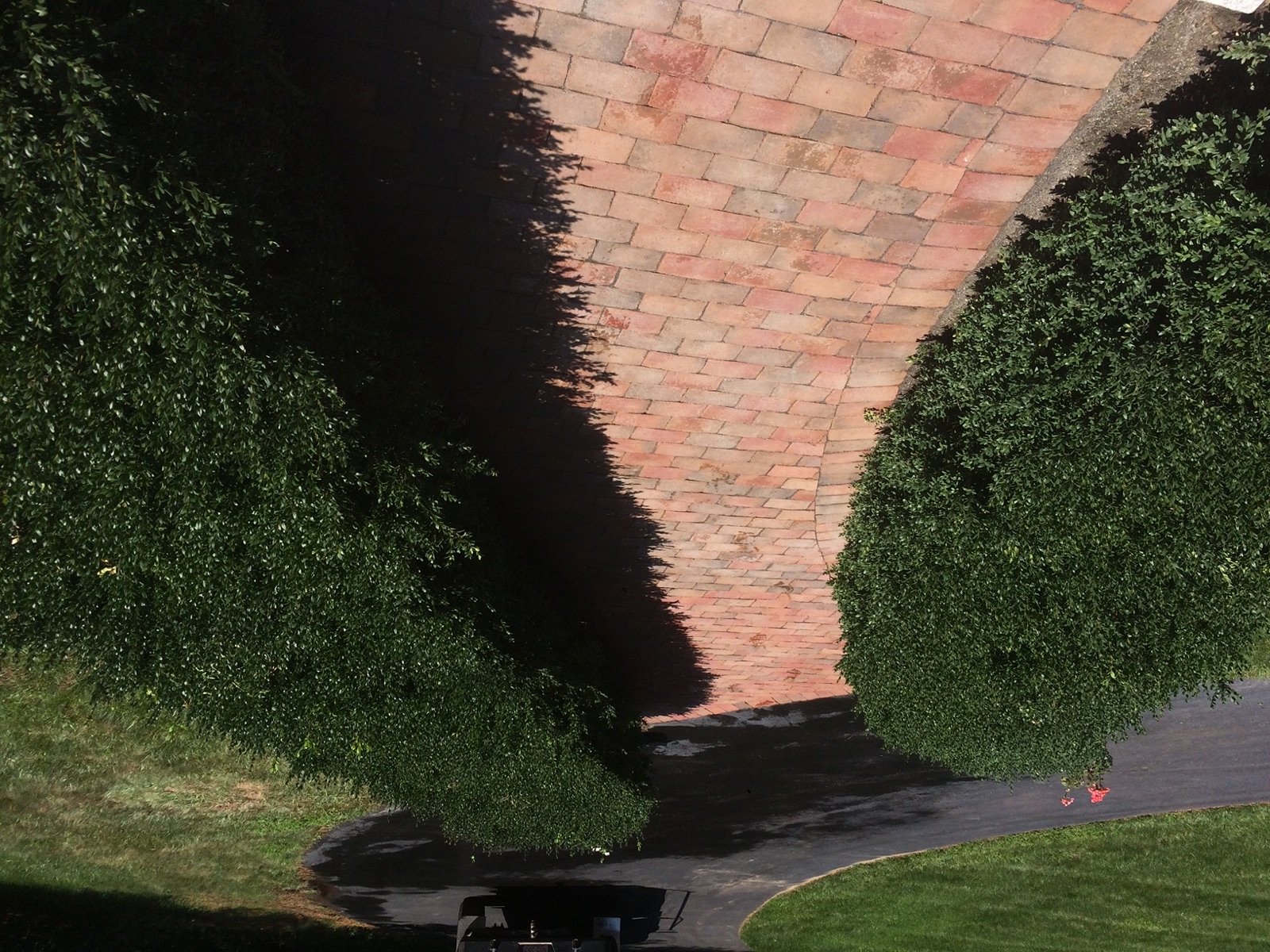 CDK Masonry Walkway through landscaped hedges
