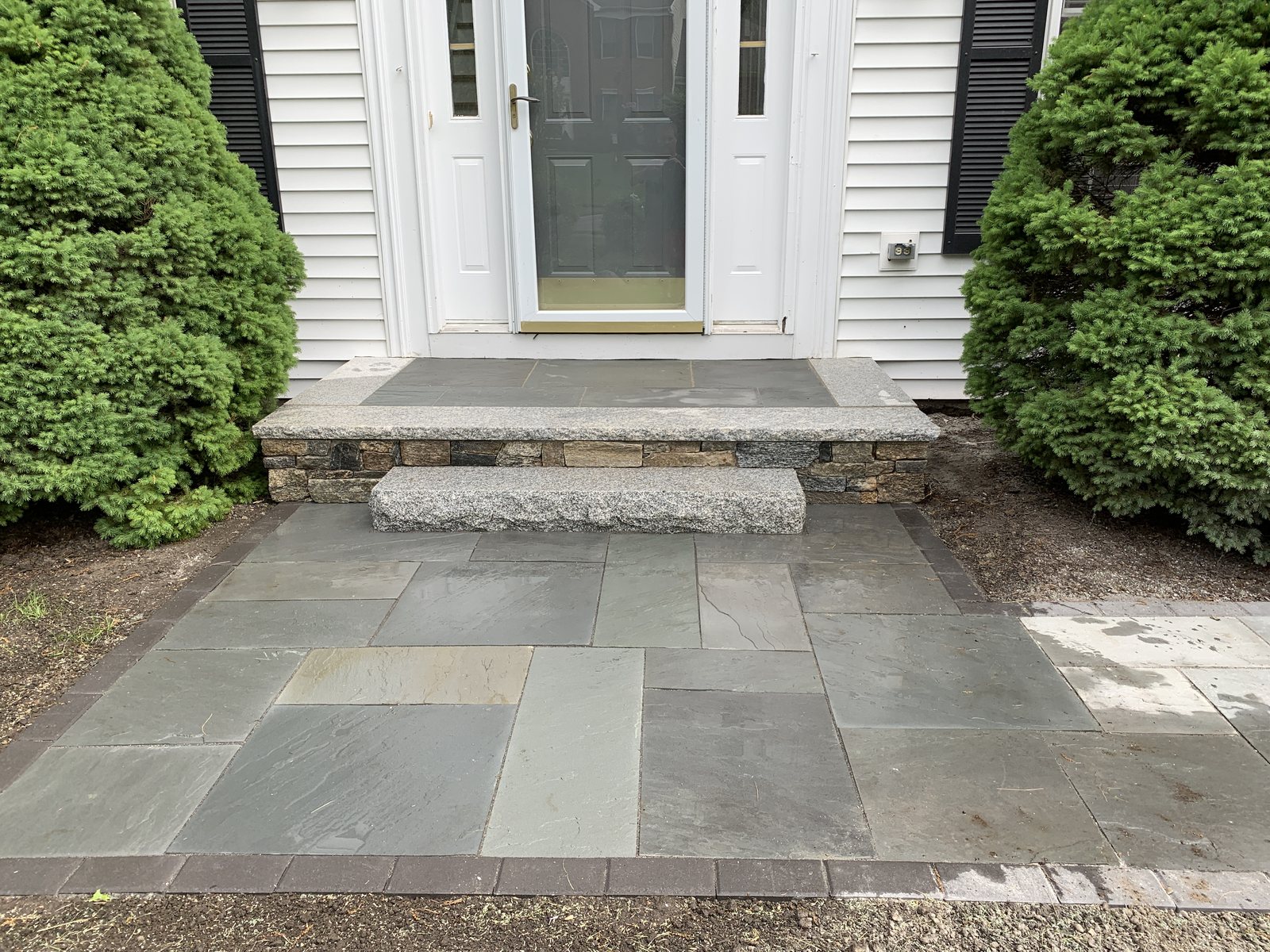 Stone Veneer Step with Granite Cap and Bluestone Inlay to Match Bluestone Walkway with Charcoal Border — Franklin, MA