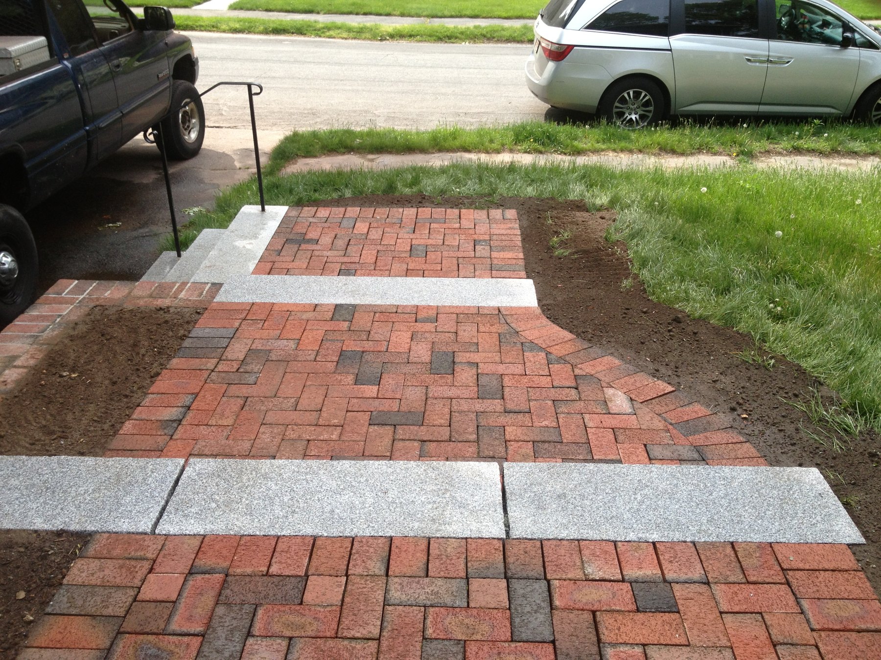 CDK Masonry Terraced clay brick walkway with granite transitions