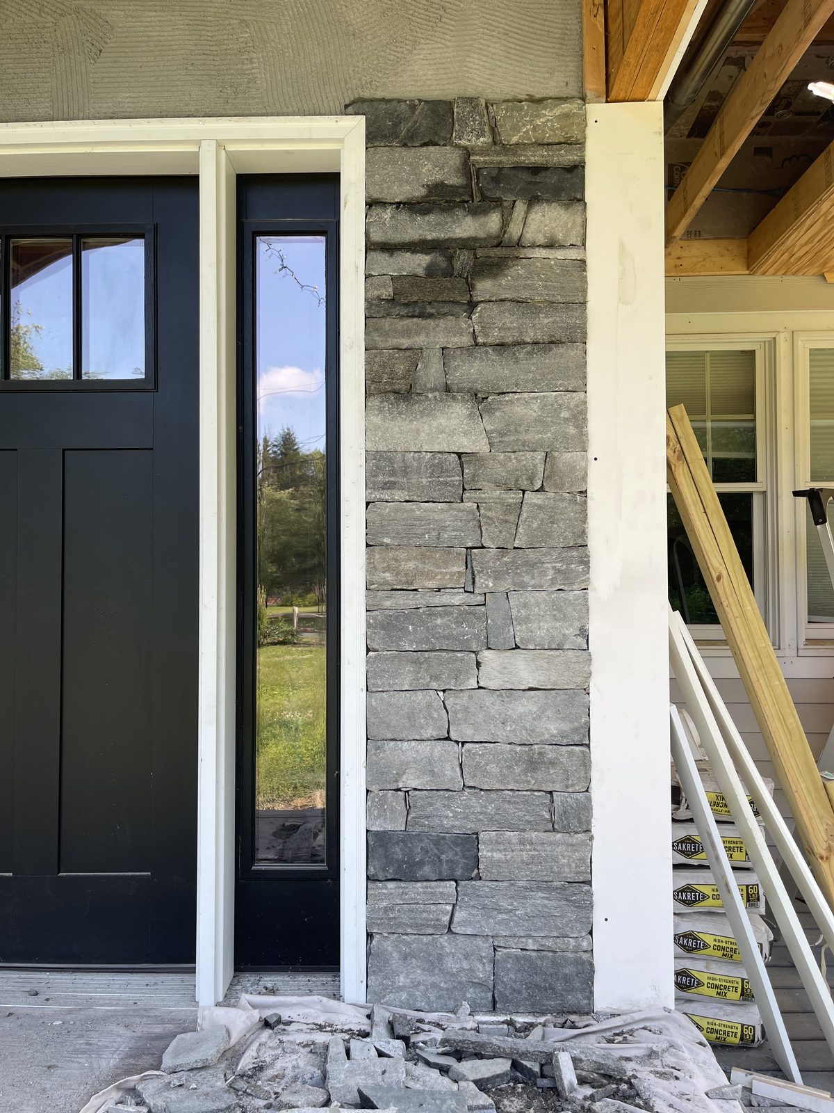 Natural stone veneer construction on the opposite side of the entry