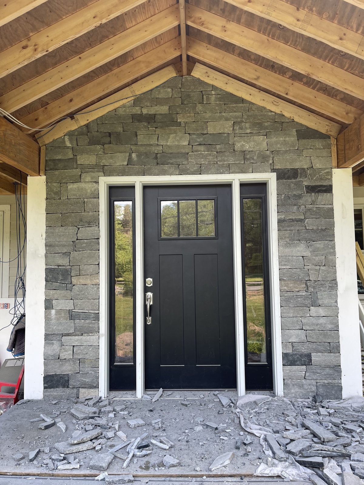 Stone veneer extended upward into the gable of the front entry