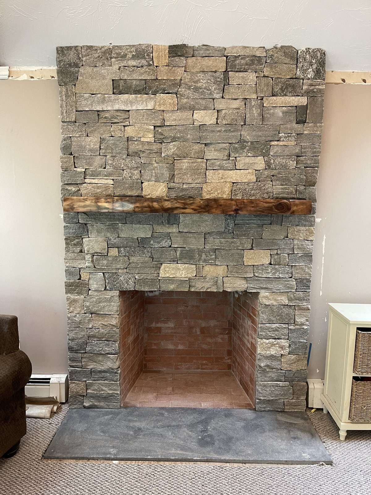 Custom chimney and natural stone veneer fireplace in Douglas Massachusetts